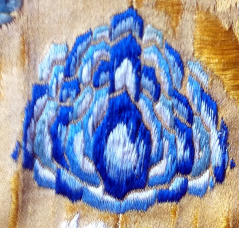Embroidered lotus in graded blues