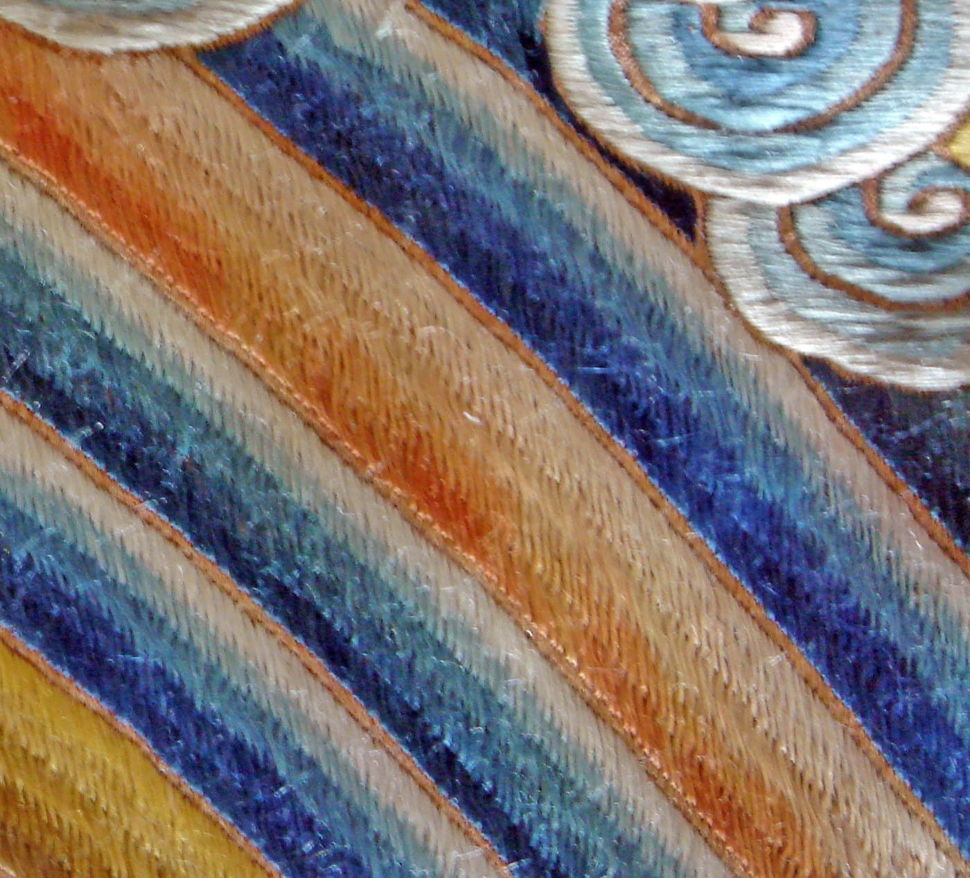 Curling waves above vertical water